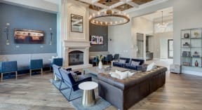 Sofa and chairs by relaxing fireplace - The Mil'Ton Luxury Apartments