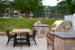 grilling station and dining area outside Valley Creek Apartments in Woodbury, MN