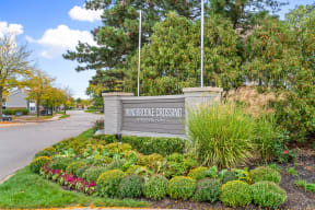 Windbrooke Crossing sign at the front of the apartment community's entrance
