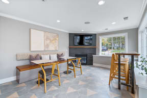 a dining room with a table and chairs and a fireplace