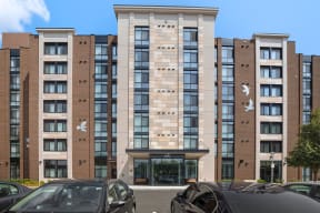 a view of the front of the building with cars parked in front of it