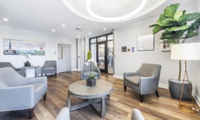 a waiting room with white walls and a wooden floor