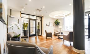 a living room with hardwood floors and a large window