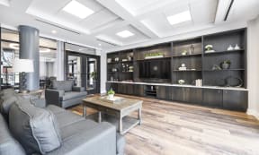 a living room filled with furniture and a large tv