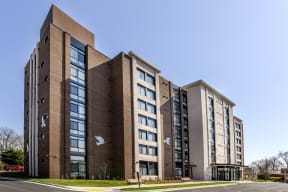 a view of the back of the building with a clear blue sky in the background
