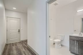 A bathroom with a toilet and sink.