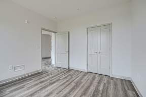A room with a grey floor and white walls.