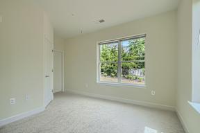 A room with a window and a door.
