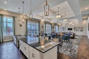 an open concept kitchen and living room with a dining room table and chairs