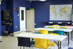 community room with blue walls and a map of the world on the wall
