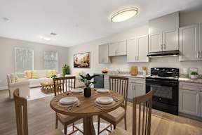 A modern kitchen with a dining table set for two.