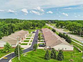 A suburban neighborhood with houses and trees.