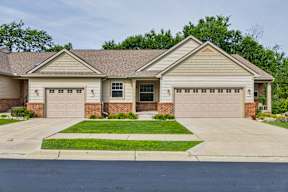 A two-car garage is attached to a house.