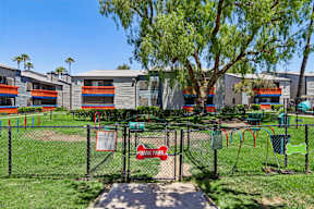A playground with a sign that says Bark Park.