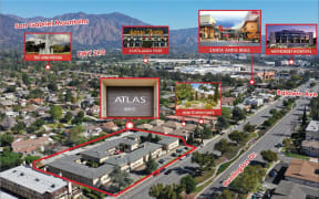 a view of the city with the atlas sign and buildings