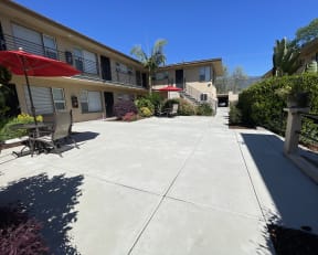 a view of the courtyard in front of an apartment building