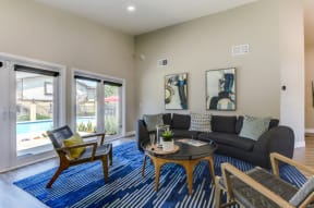 our apartments offer a living room with a sofa coffee table and views of the pool
