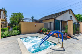 take a dip in the hot tub at villas at houston levee west apartments in