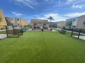Dog Park and Outdoor Shaded Seating at Whiffle Tree Apartment homes in Huntington Beach, CA.