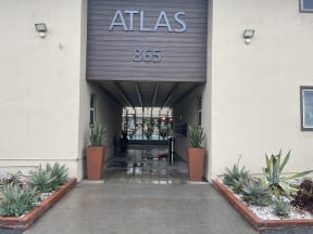 atlas 856 entrance to the building with potted plants