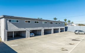 A parking garage with a car parked in the first bay.
