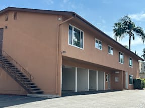 A building with a staircase leading to the second floor.