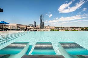 A pool with a view of the city skyline.