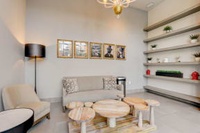 Living room with a sofa and coffee table at The Apartments at Lincoln Common, Chicago