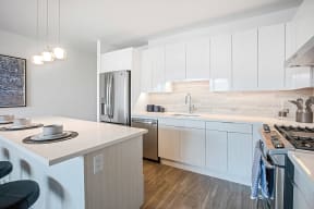 Kitchen with Island at The Apartments at Lincoln Common, Chicago, 60614