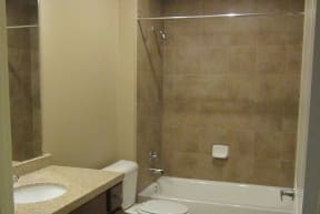 a bathroom with a toilet sink and bathtub
