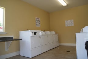a washer and dryer in a room with a window