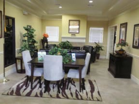 a dining room with a table and chairs