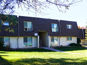 A building with a number 73 on it at Mountain Terrace Apartments, Westminster, CO.