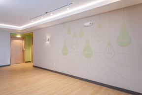 A wall with light bulbs and the word "dreams" written on it.