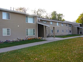 Apartment complex with a grassy area in front at Grand Manor Apartments, Grand Junction, CO, 81501