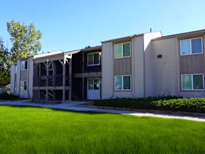 A building with a green lawn in front at Gateway Village Apartments, Fort Morgan, 80701
