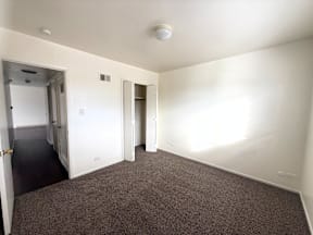 A room with carpeted floor and white walls at Townview Plaza Apartments, Denver, 80204  .