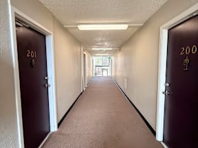 A long hallway with doors 201 and 200 on the sides.