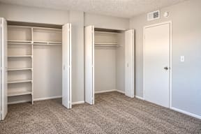 A room with white closet doors and carpeted floor t Mountain Terrace Apartments , Westminster, CO, 80031