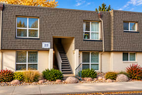 A brown building with the number 23 on it t Mountain Terrace Apartments , Westminster, CO, 80031