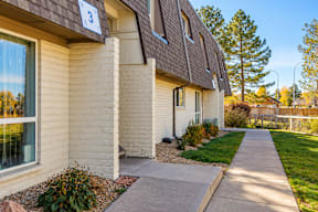 A house numbered 3 with a brown roof and a white wall t Mountain Terrace Apartments , Westminster, CO, 80031