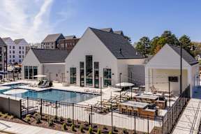 A modern house with a pool in the backyard.