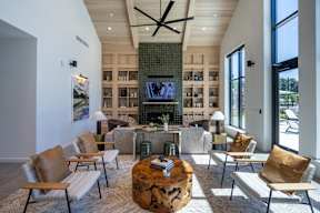 A living room with a fireplace and a television.