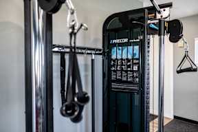 A close up of a PRECORD gym machine.