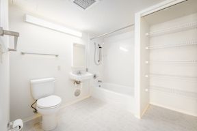 a bathroom with a toilet sink and bathtub