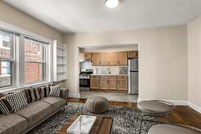 a living room with a couch and a table