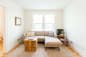 a living room with a couch and a large window