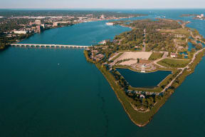 an aerial view of a park and a body of water