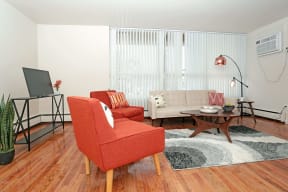 a living room with a couch and chairs
