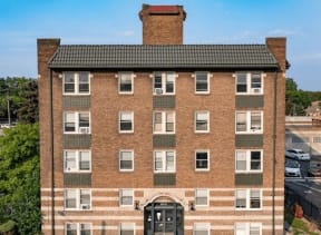 a large brick building with a black door